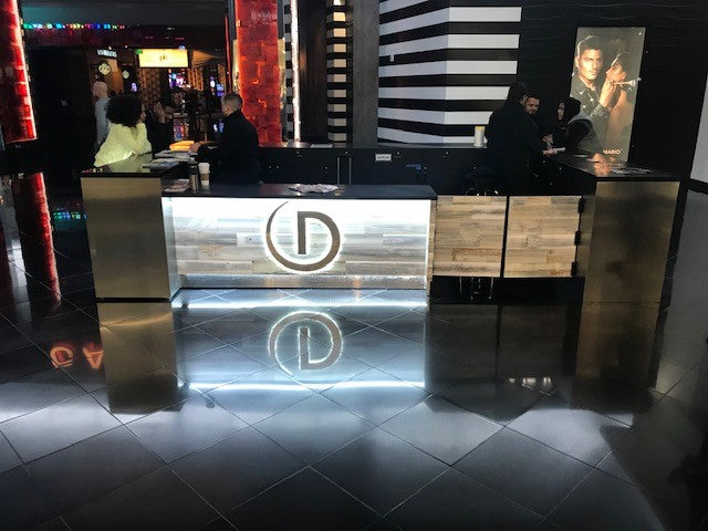 Showcases an LED Custom Reception Counter in a resort setting