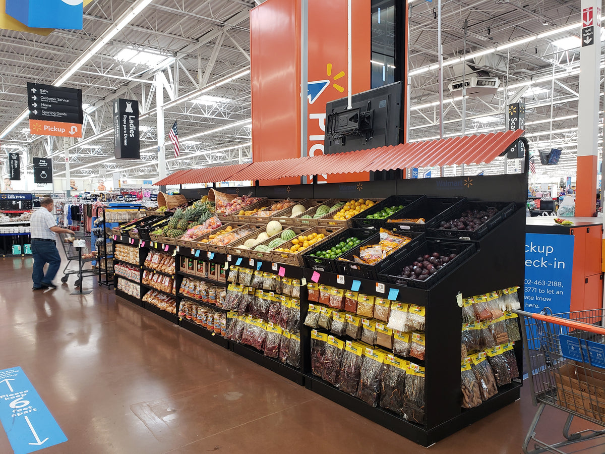 Custom grocery display table with fresh fruits and vegetables, featuring a Kroger logo.