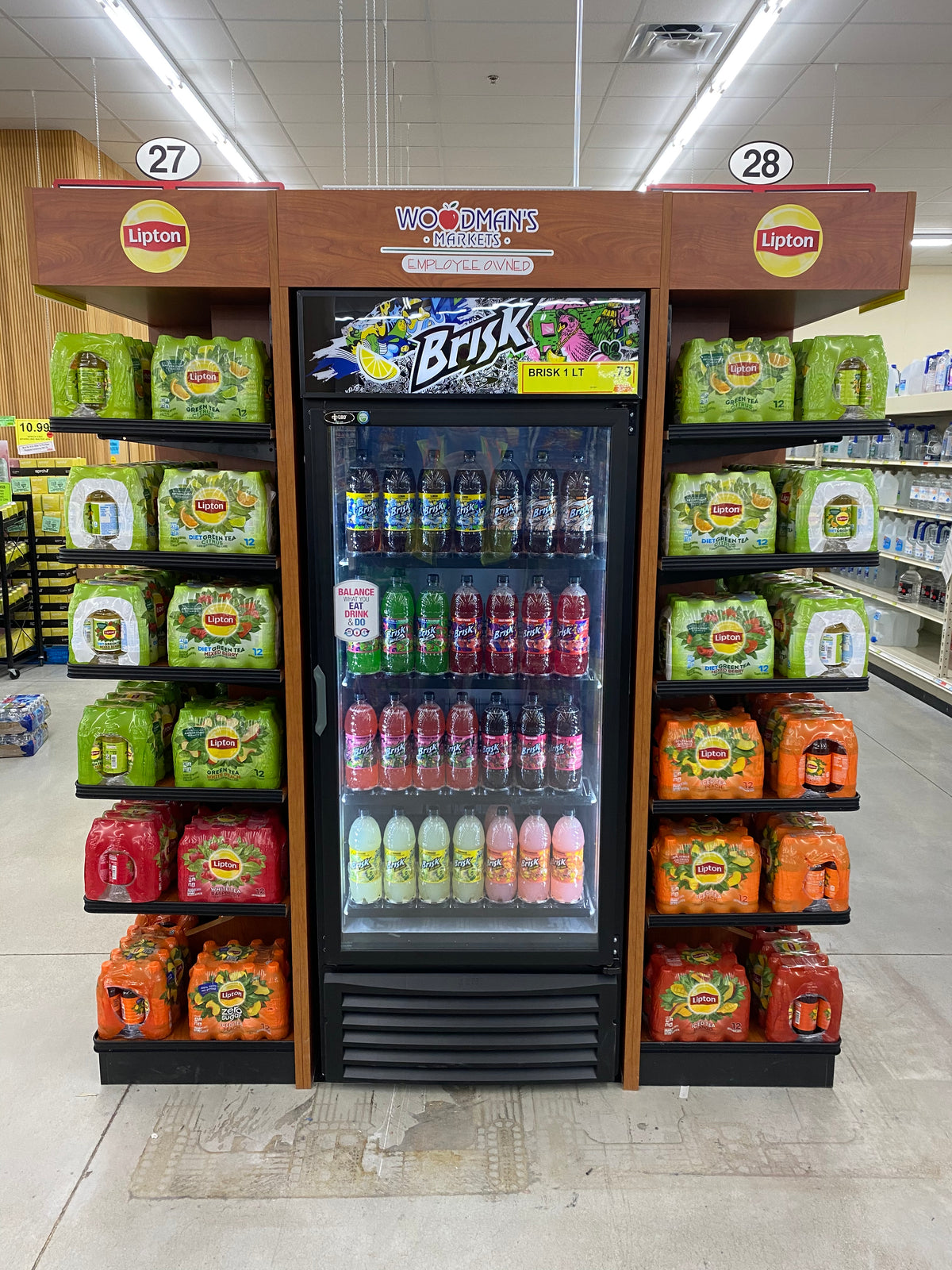 Grocery End Cap Display with Lipton and Brisk brands in a store setting.